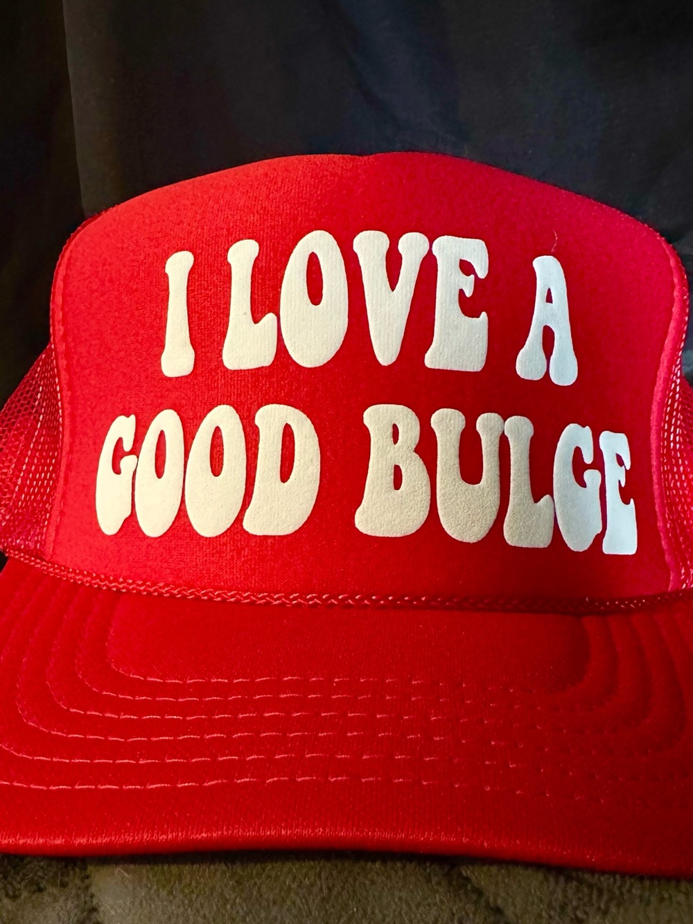 Red Trucker Hat with White Slogan - "I LOVE A GOOD BULGE"